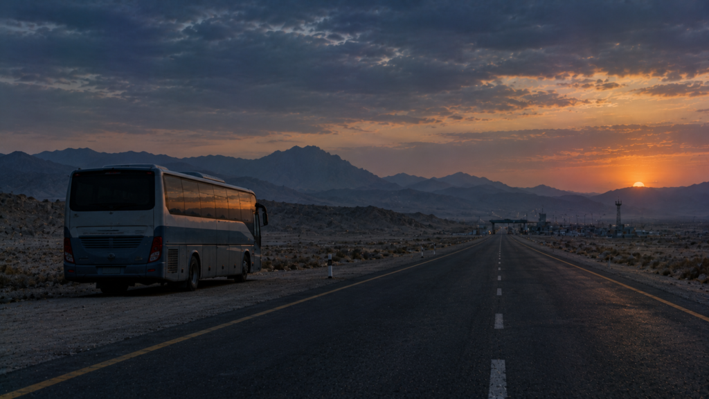 Parked passenger van on an empty mountain highway at dusk